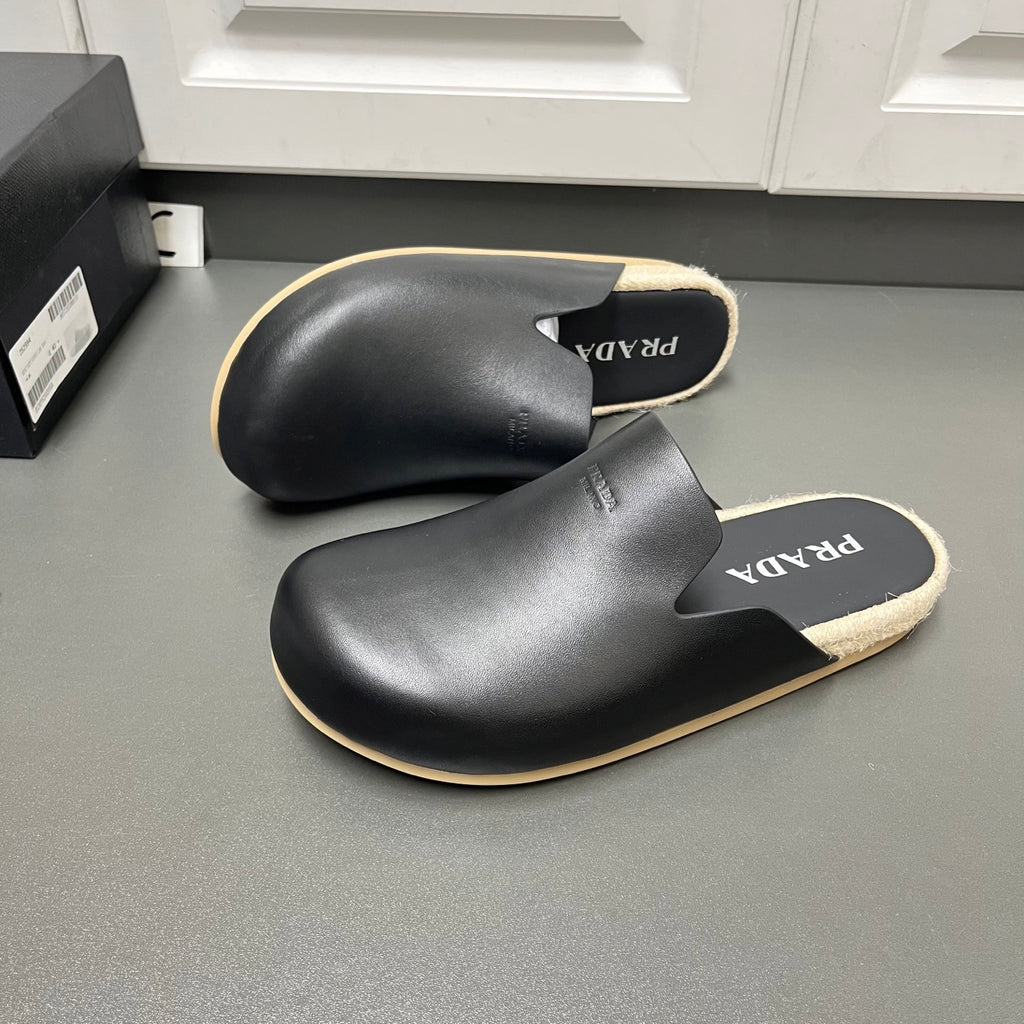 Prada black slide sandals with cutout upper, beige trim, jute-style sole edge