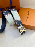 Louis Vuitton belt detail: navy strap with monogram and floral patches plus gold buckle