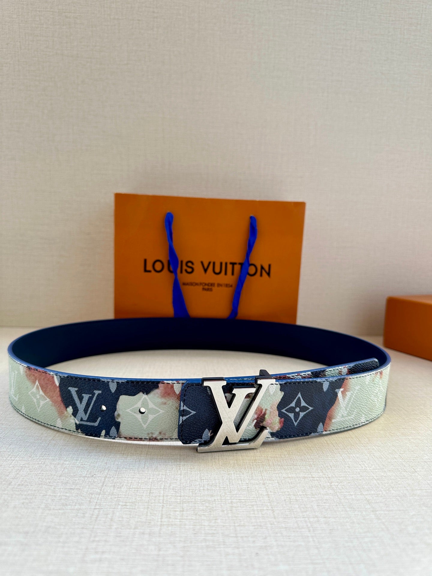 Louis Vuitton belt in navy and light blue with floral patchwork and large LV buckle