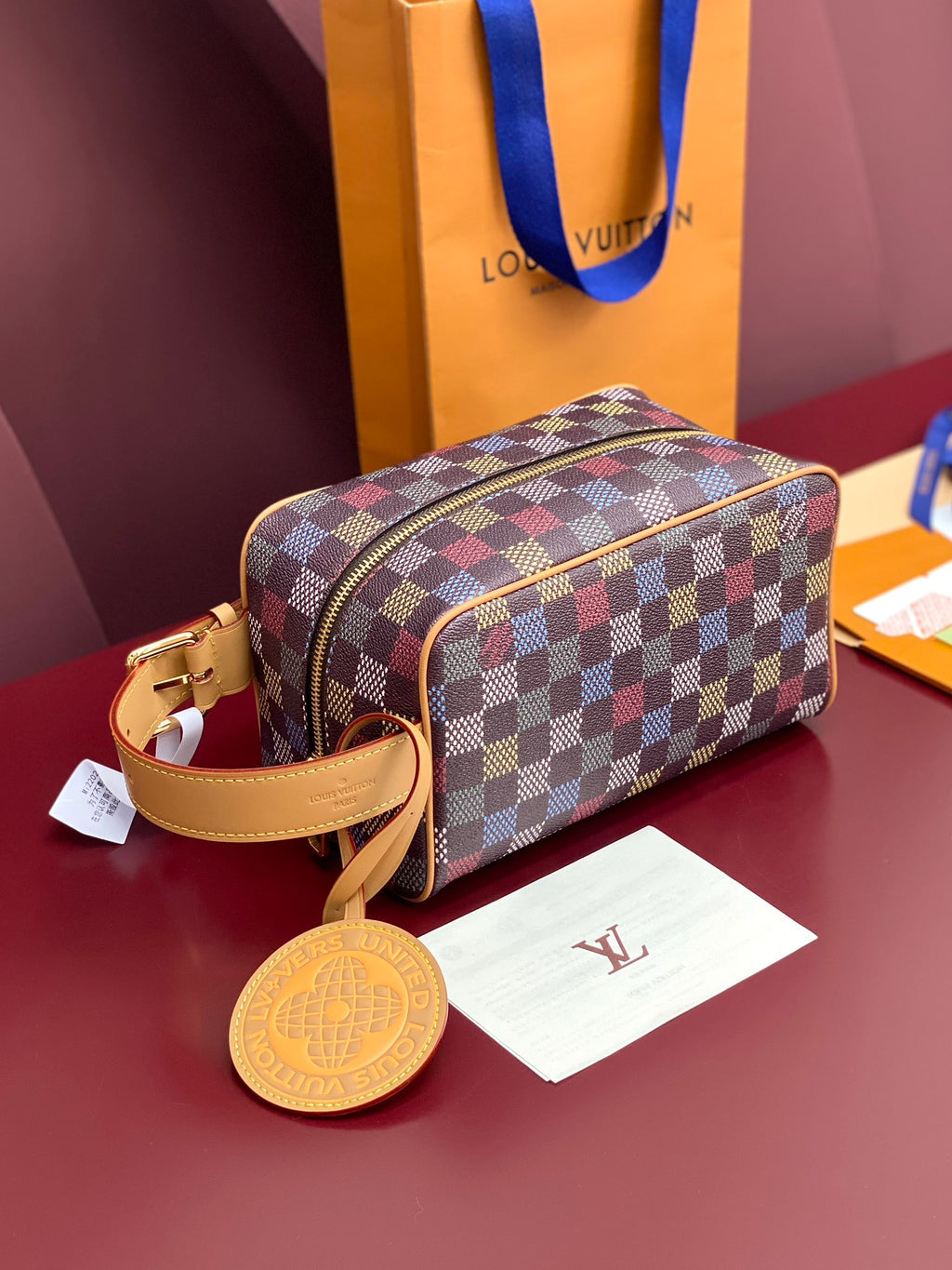 Louis Vuitton small bag with check pattern, top zipper, tan leather trim