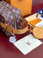 Louis Vuitton check small bag with tan strap and round globe charm