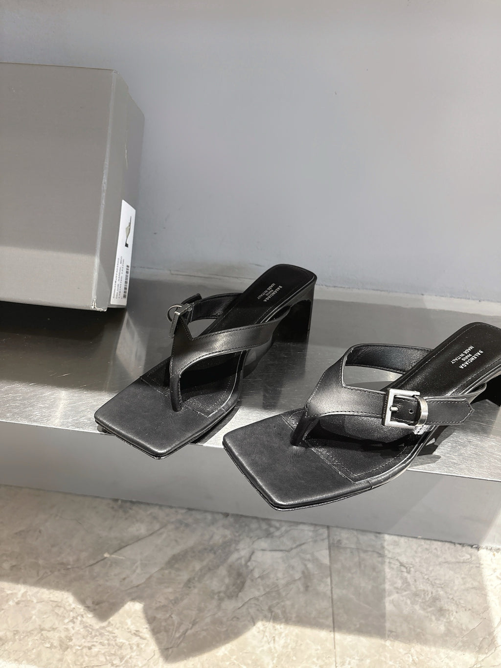 Balenciaga black leather sandals with buckle strap, square toe, side-by-side