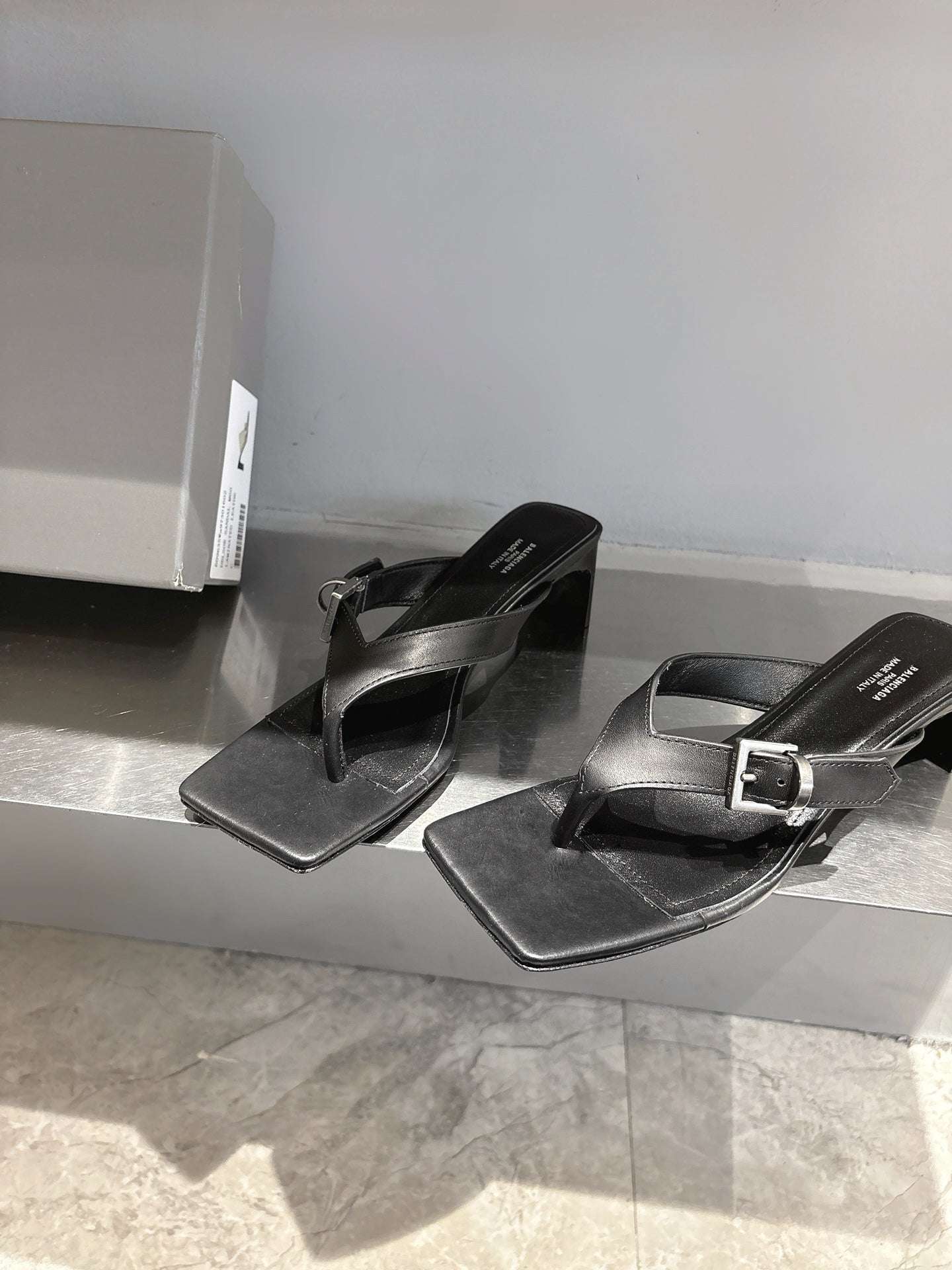 Balenciaga black leather sandals with buckle strap, square toe, side-by-side