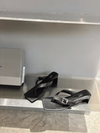 Balenciaga black leather sandals with silver buckle and square toe, one pair on shelf