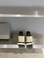 Balenciaga cream and black block-heel sandals with front buckle detail
