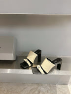 Balenciaga cream and black block-heel sandals with metal buckle at instep