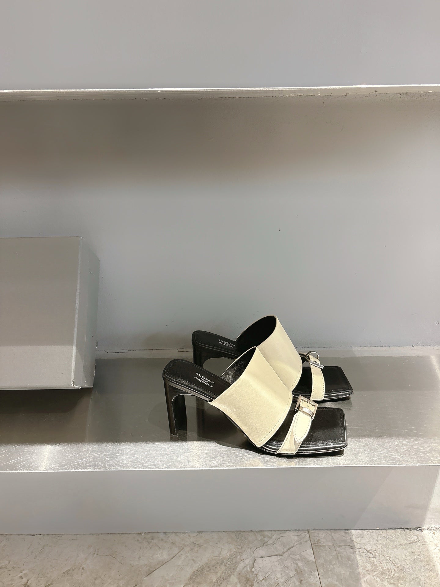 Balenciaga cream slide sandals with black toe strap and chunky block heel