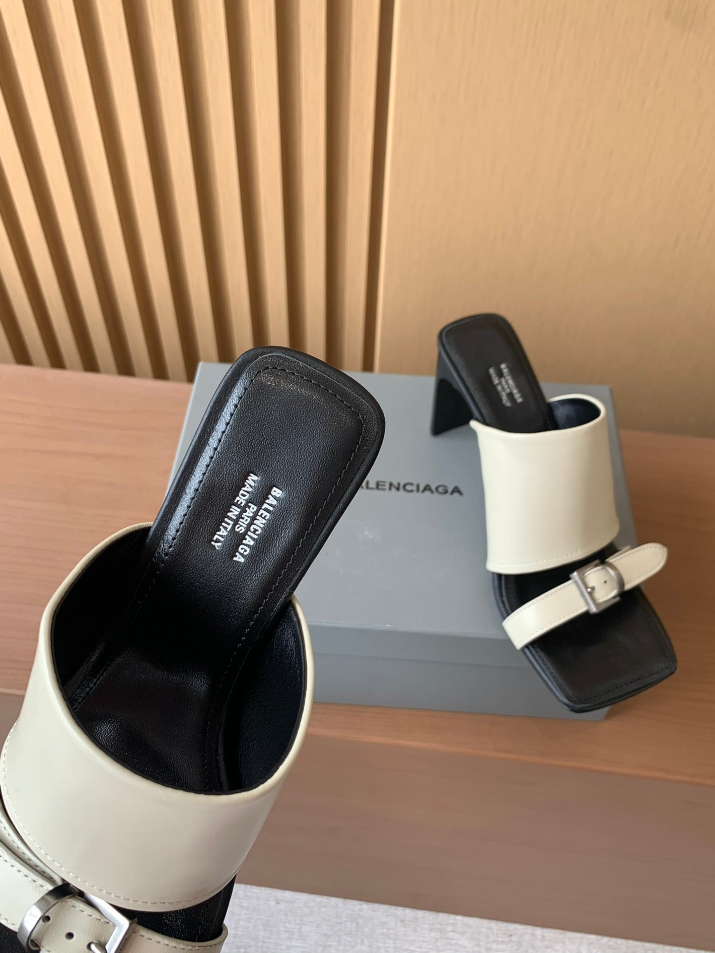 Balenciaga slide sandals with cream strap and black leather upper, thick heel