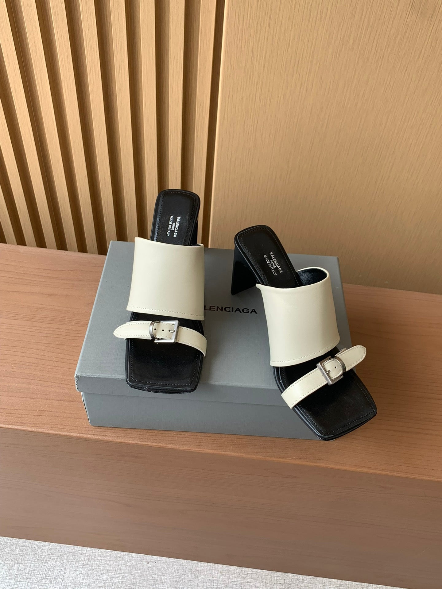 Balenciaga heeled sandals with cream ankle cuff strap and black footbed