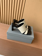 Balenciaga heeled sandals with cream front strap over black footbed, open toe