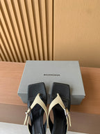 Balenciaga thong sandals in black and cream with gold buckles, in box