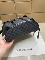 Louis Vuitton Damier-check backpack with top handle, rounded body, and zipper closure