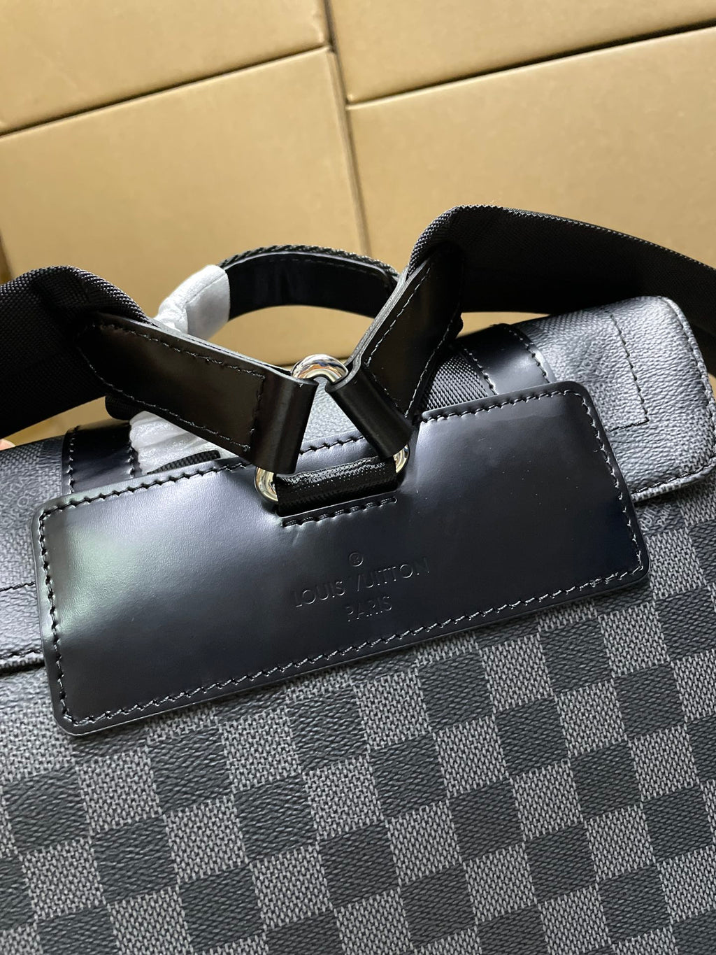 Louis Vuitton Damier-check canvas backpack with leather front pocket and strap hardware