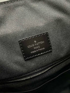 Louis Vuitton made in France authenticity label on textured bag interior