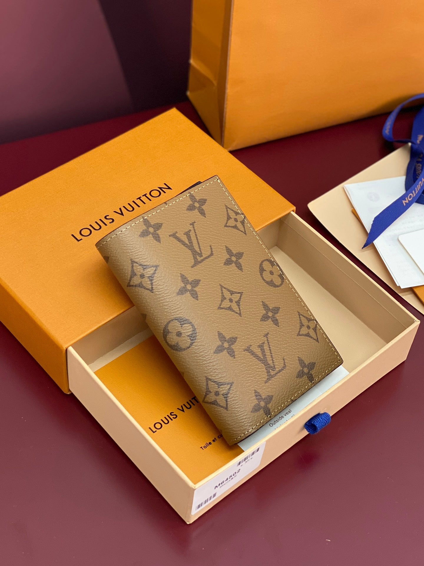 Small bag with beige monogram pattern, in gift box with logo label.