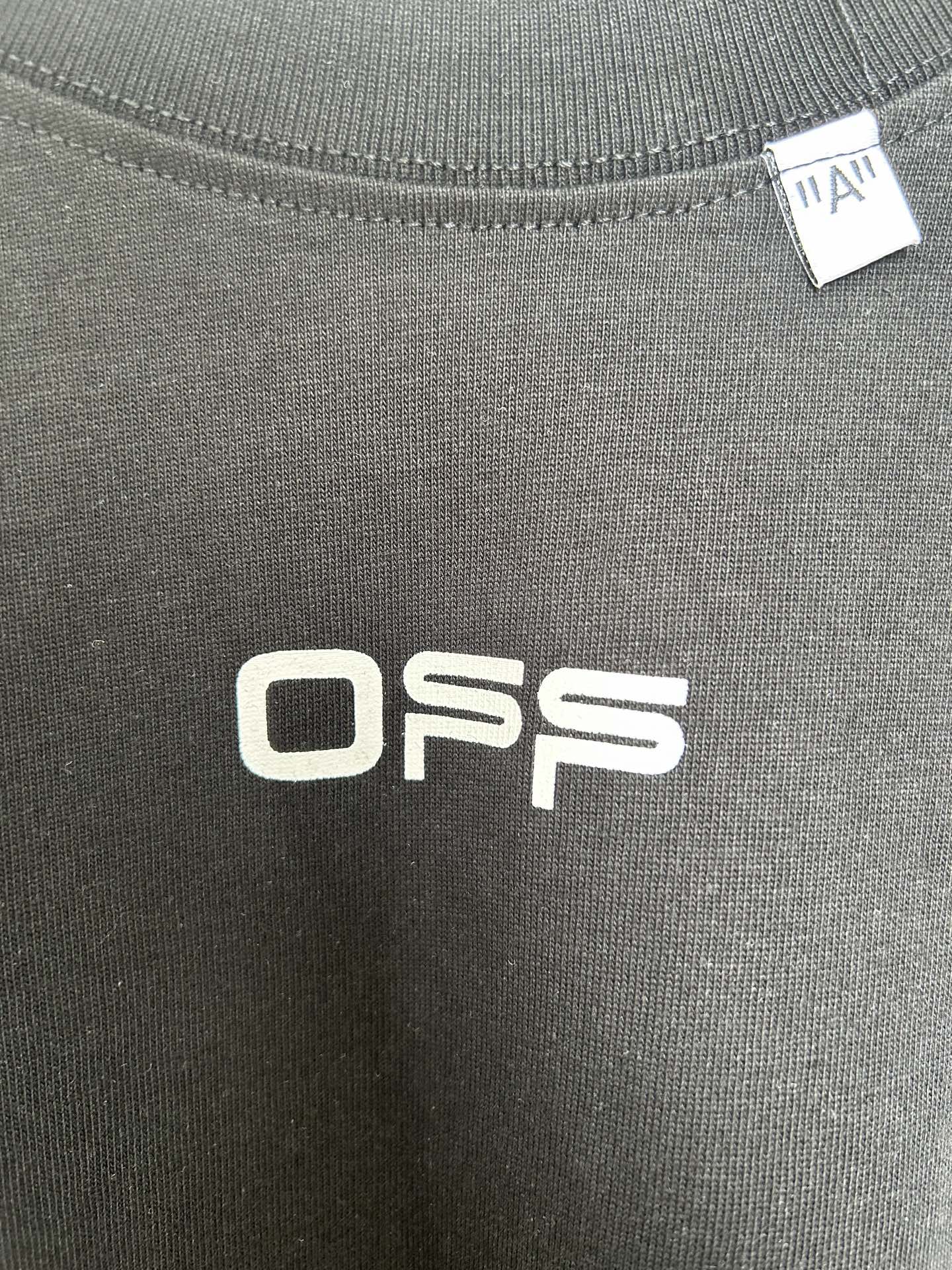 Off White OFFS logo screen print on dark T-shirt fabric