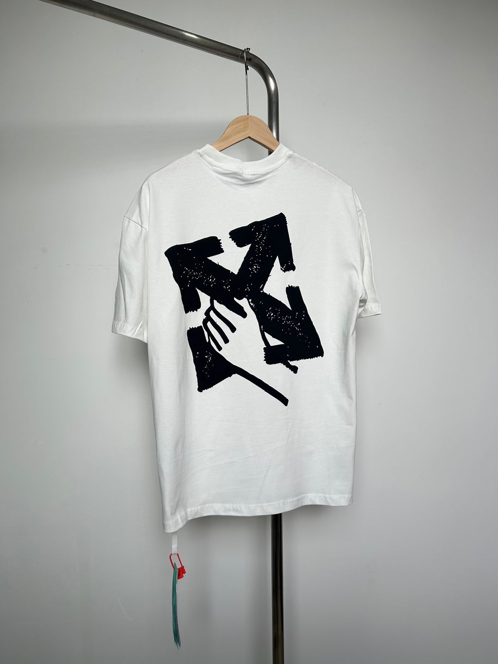 Off-white T-shirt with large black graphic illustration on front