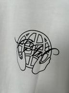 Off-white T-shirt close-up of black line-art graphic on chest