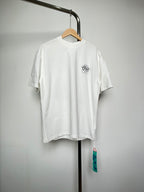 Off-white T-shirt with small black graphic logo at left chest