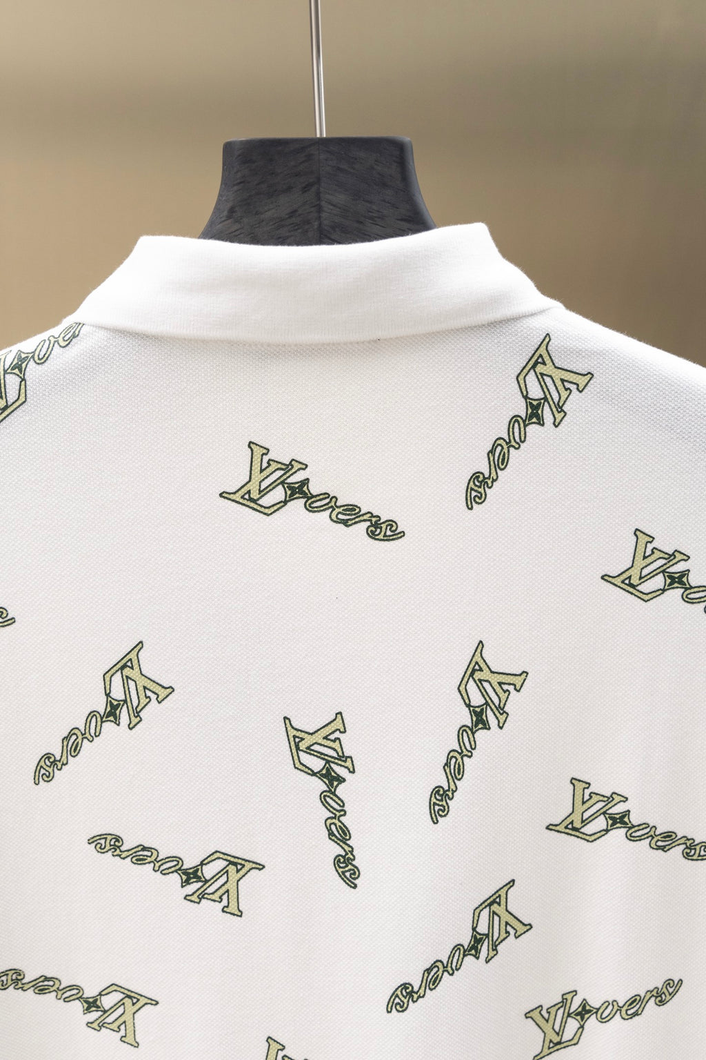 White polo shirt back with high collar and repeating Louis Vuitton-style logo print