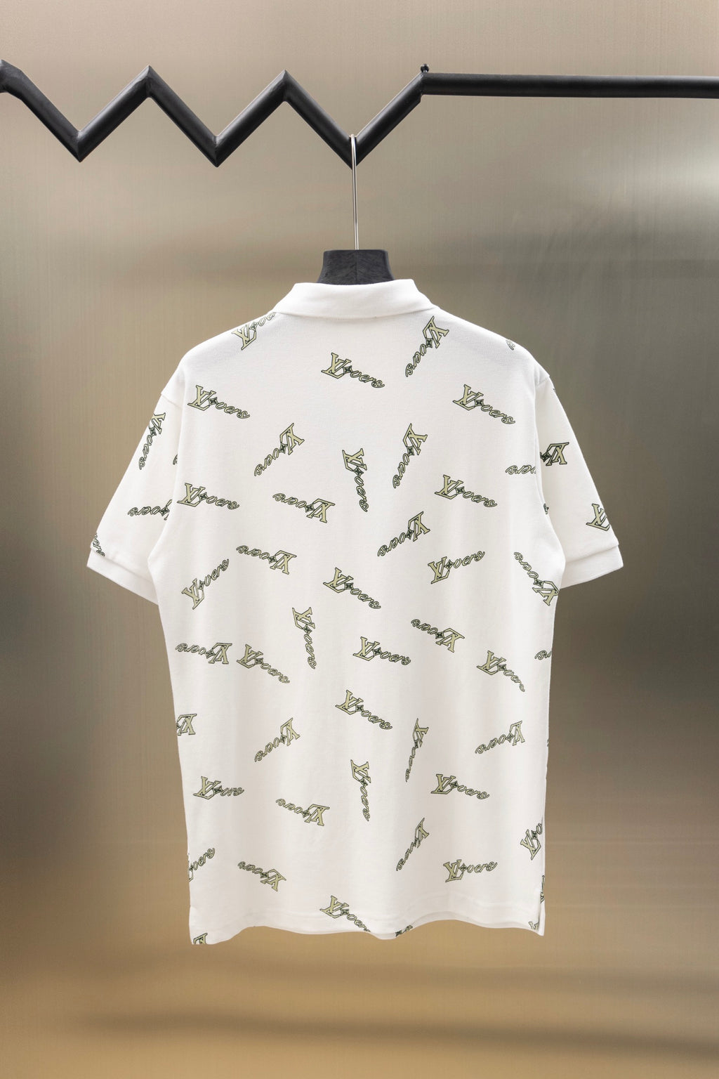 White short-sleeve polo shirt, back view, with scattered Louis Vuitton-style logo print