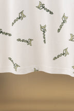 White polo shirt lower hem with allover Louis Vuitton-style logo print