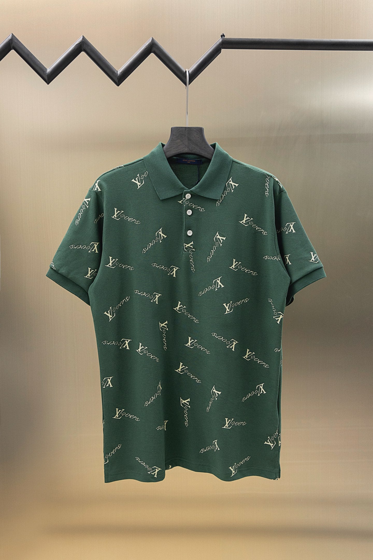 Louis Vuitton polo shirt in dark green with short sleeves, button placket, and logo pattern