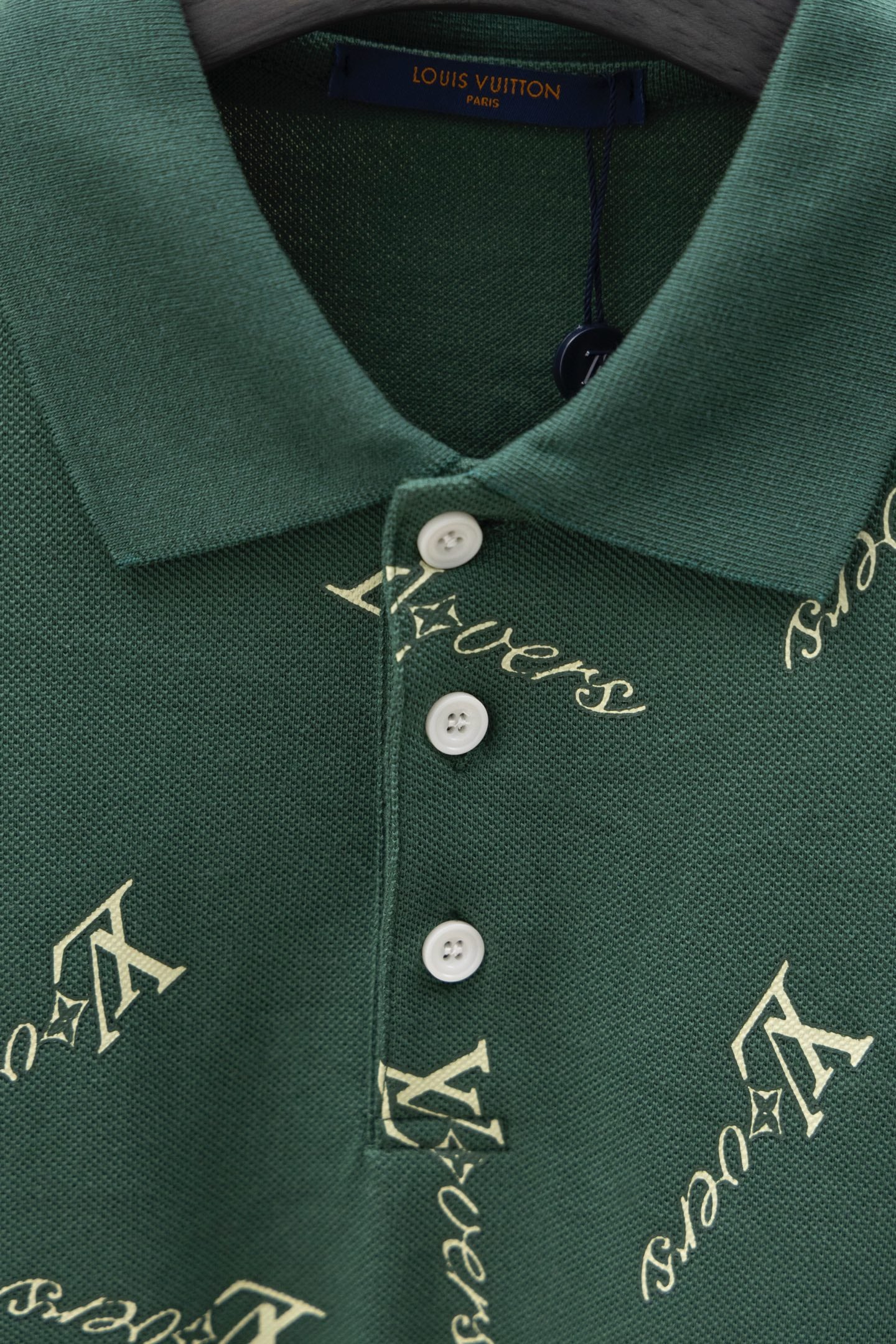Louis Vuitton polo shirt neckline in dark green with white buttons and logo print