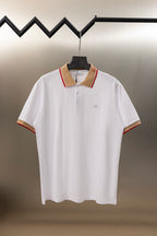 Burberry white polo shirt with button placket and tan collar in red trim