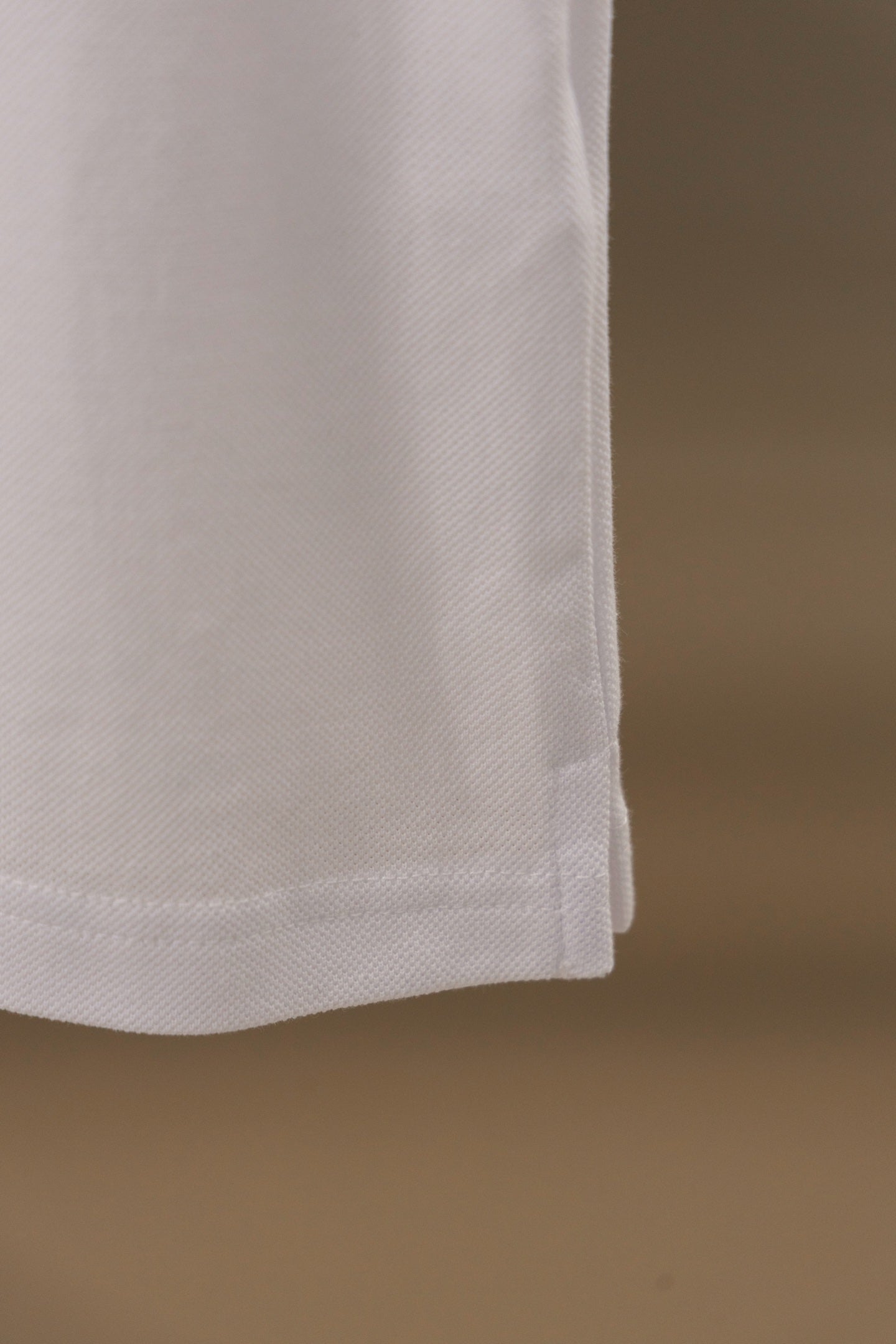 Burberry polo shirt side hem with clean stitched edge