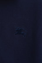 Navy polo shirt chest logo embroidery detail
