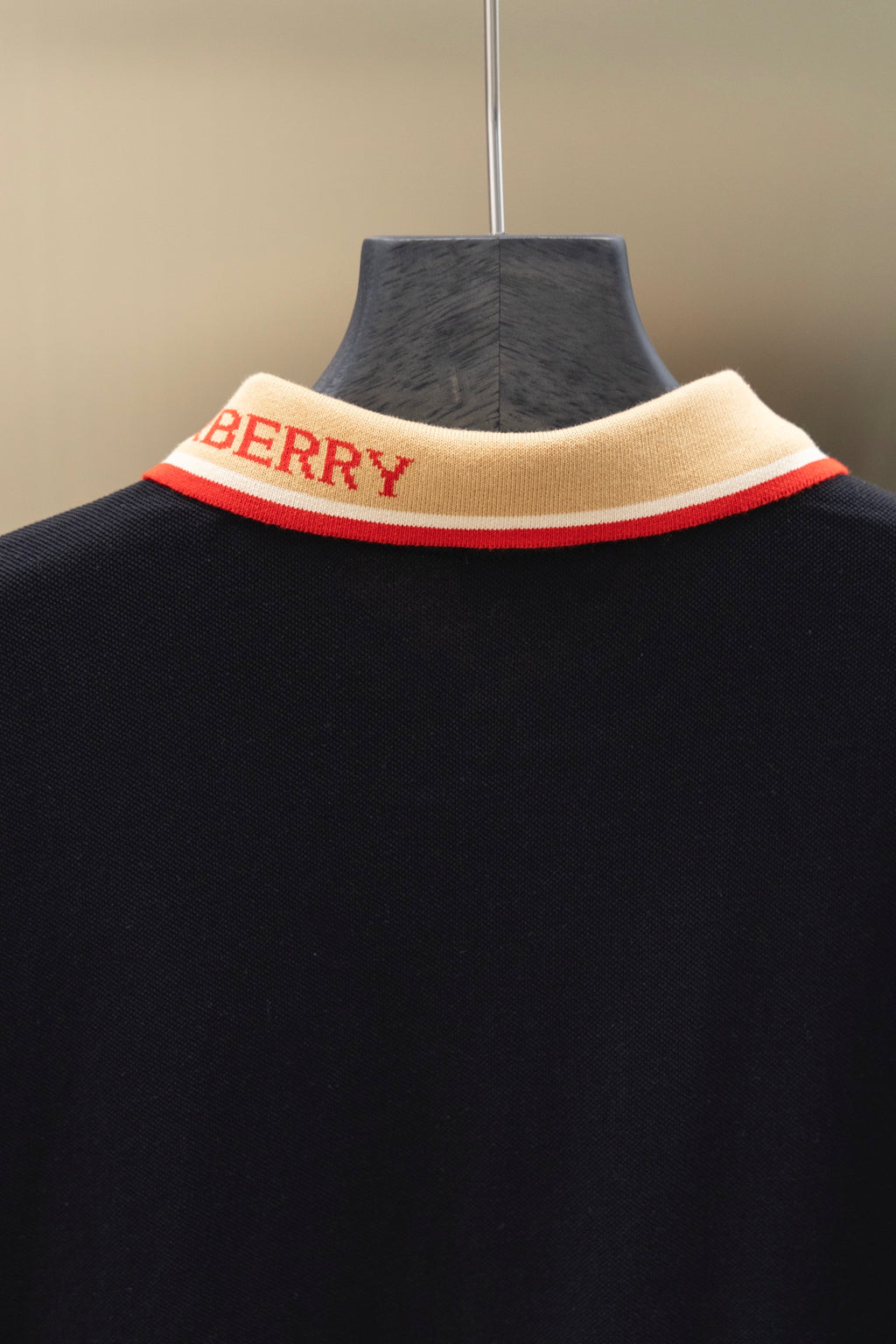Burberry polo shirt neckline with beige collar band and red trim