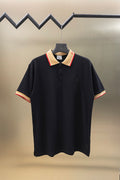 Burberry navy polo shirt with button placket and red-trim beige collar