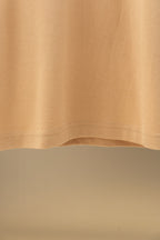 Tan polo shirt hem and side seam detail