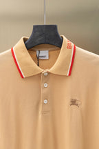 Light beige polo shirt collar close-up with red and white trim, button placket