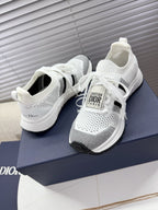 White mesh unisex sneakers with white laces and Dior logo tongue patch