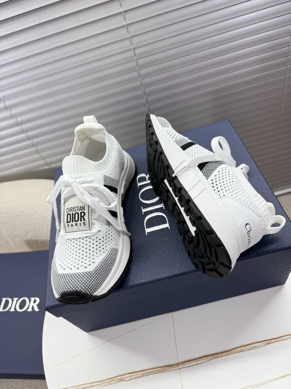 White mesh unisex sneakers with black side stripe and chunky black sole