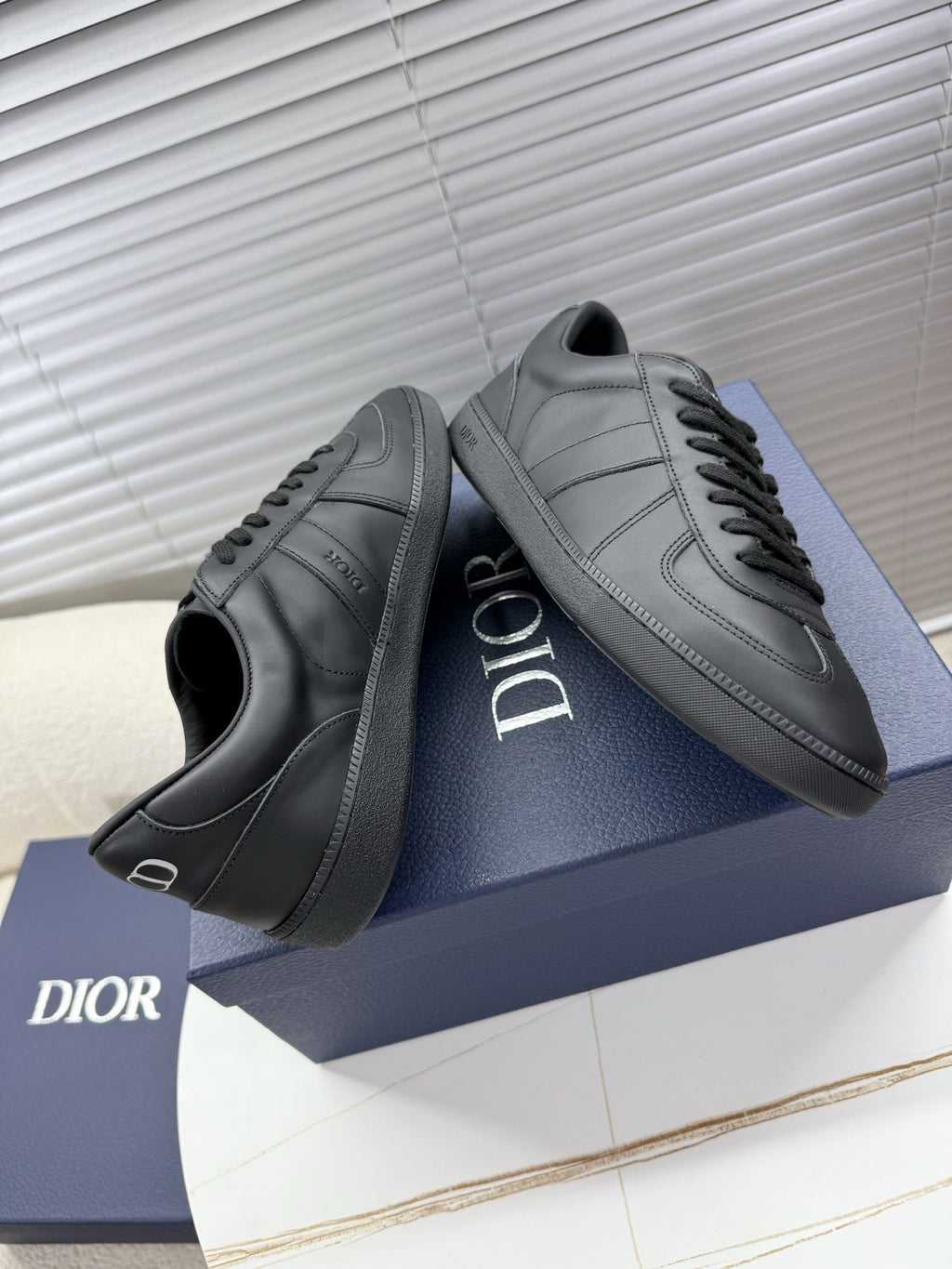 Dior gray leather sneakers, lace-up with side stripe panels and logo.
