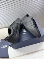 Dior gray leather sneakers, lace-up with side stripe panels and logo.