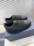 Dior black leather sneakers with lace-up, low profile sole and side logo.