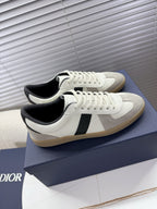 White sneakers with black side stripe and cream sole, lace-up closure, Dior detail