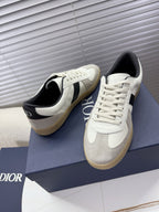 White sneakers with black heel lining, cream sole, lace-up front, Dior logo