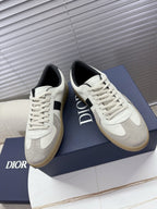 White lace-up sneakers with black side panel, cream sole, Dior logo detail