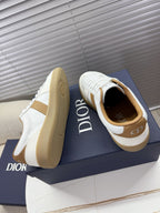 White and tan Dior sneakers with chunky gum-style rubber soles
