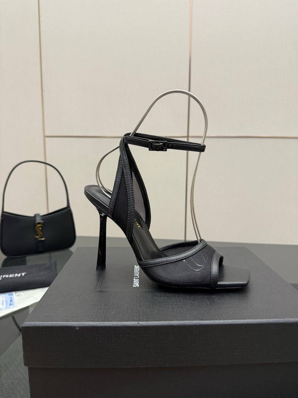 YSL ladies black strappy heeled sandals on a display box