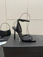 YSL ladies black strappy heeled sandals on a display box