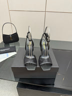 YSL ladies black strappy sandals, back view on a box
