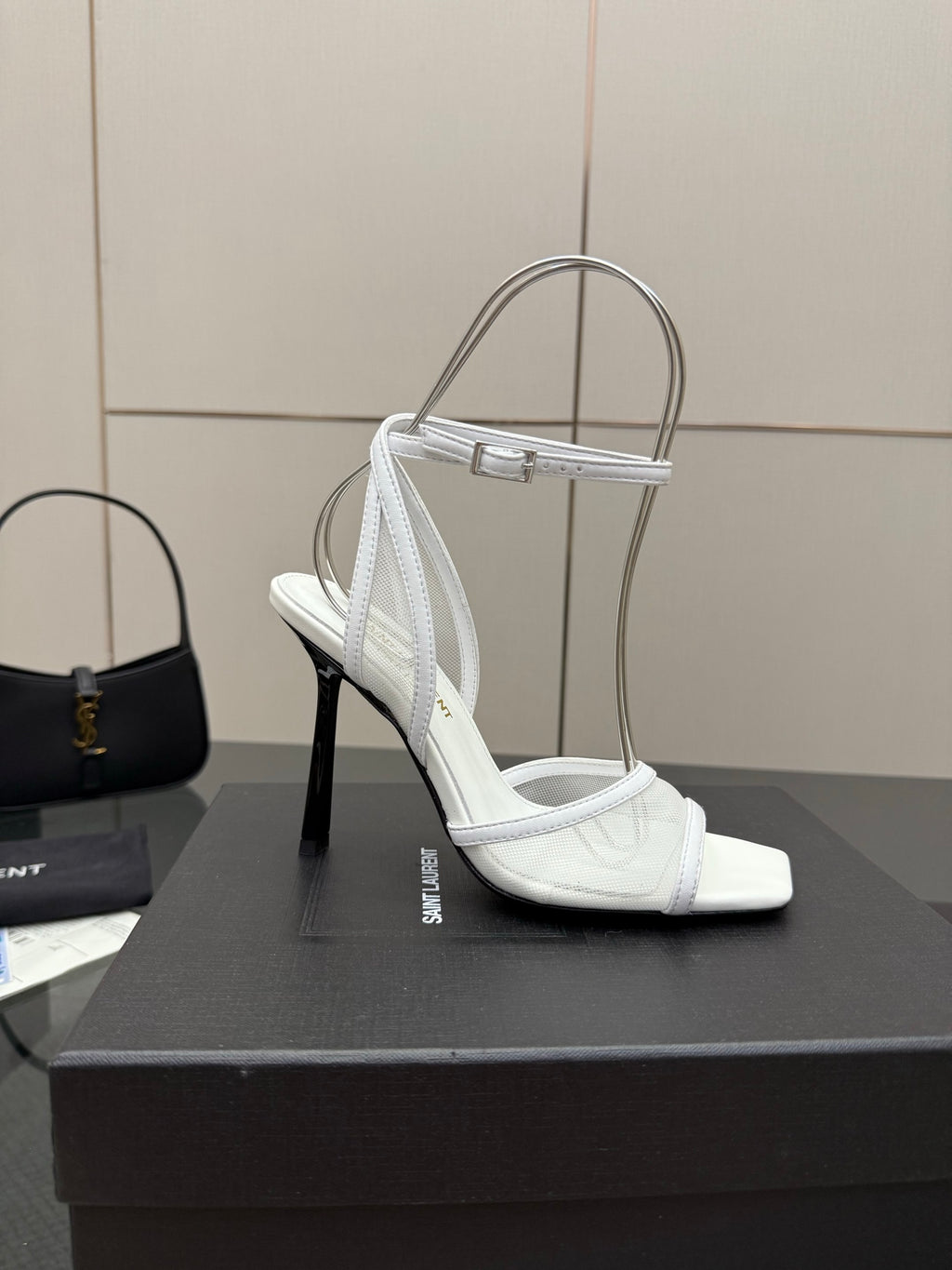 White women’s heeled sandal with open toe, ankle strap, and side strap detail