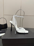 White women’s heeled sandal with open toe, ankle strap, and side strap detail