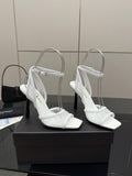White women’s heeled sandal with open toe, ankle strap, and slingback-style fit